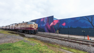 Napa Wine Train with Mural behind.